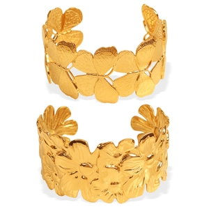 Elegant gold titanium cuff bracelets featuring butterfly and daisy floral relief designs