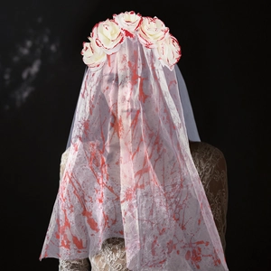 Detailed view of Halloween ghost bride veil with red blood splatters and roses