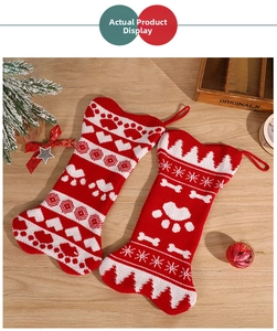 Close-up of knit bone-shaped Christmas stockings with festive claw prints and heart patterns