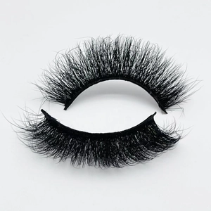 Detail of 20mm thick curly faux mink eyelashes showing voluminous textured black fibers