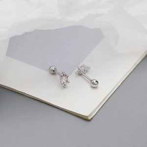 Close-up of S925 sterling silver stud earrings with sparkling cubic zirconia on white card