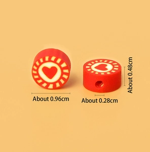Macro shot of red heart polymer clay beads with dimensions 0.96cm for jewelry making
