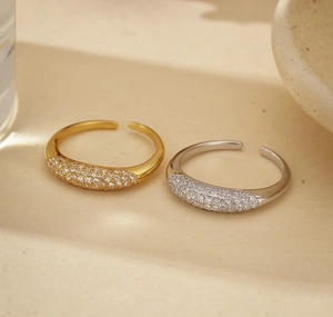 Close-up of wide band 925 sterling silver open ring with micro-pave zirconia stones