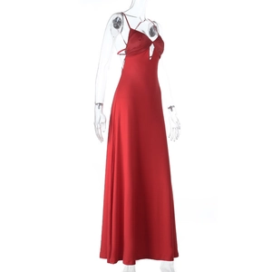 Detail of red satin maxi dress with spaghetti straps and triangle cutout at the chest