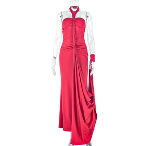 Front view of red halter neck maxi dress with waist pleats and draped fabric on a mannequin