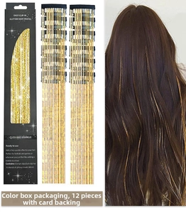 Detailed view of clip-in gold glitter hair tinsel extensions in a set of 12 pieces