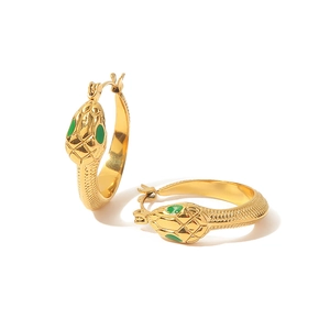 Gold-plated snake hoop earrings with green enamel eyes and detailed scale texture