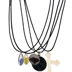 Handmade resin dried flower pendants on black wax cord necklaces in multiple colors