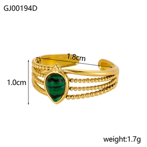Detail view of a gold tiered ring with green malachite gemstone and product dimensions