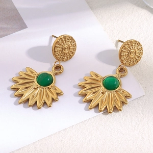 Detail of 18K gold plated sunburst earrings featuring round green agate stone inlay