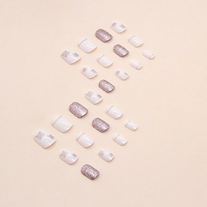 Short square press-on nails with white base, silver snowflakes and purple glitter