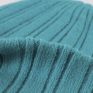 Thick double-layer ribbed knit beanie in deep teal blue with soft thermal texture