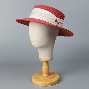 Elegant red flat brim straw hat for women featuring beige ribbon and bead decoration