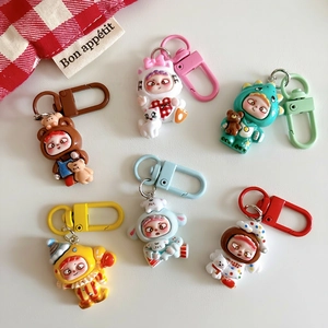 Set of six cute cartoon animal doll keychains in dinosaur and cat outfits on white background