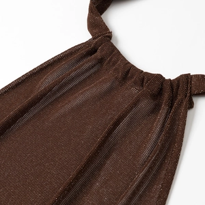 Close-up of brown lurex knit fabric showing shimmering metallic texture and halter neck detail