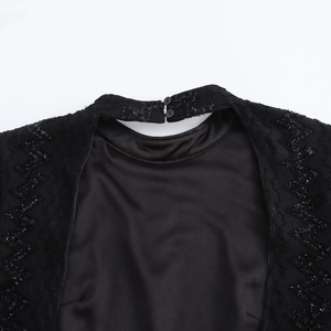 Elegant black backless bodycon dress with high neck cut-out detail and textured shoulders
