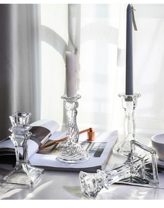 Detailed view of assorted crystal glass candle holders for elegant home decoration