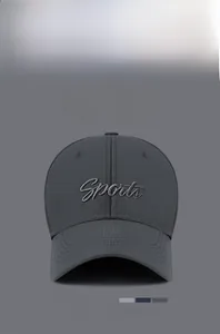 Detail of 3D Sports embroidery and grid texture on this dark grey baseball cap