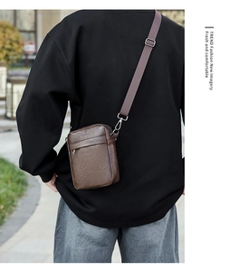 Detail of dark brown PU leather crossbody phone bag shown on a model in street setting