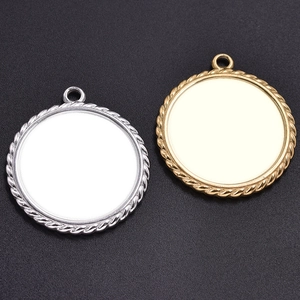 Detailed macro view of gold and silver round pendant trays with twisted rope border design
