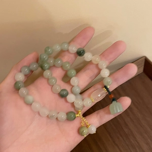 Ethnic lotus seedpod pendant bracelet with multi-color green and white jade-style beads