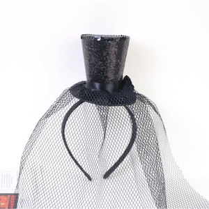 Detail of black sequined mini witch hat headband with gothic lace mesh veil for Halloween