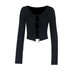 Detail of black long-sleeve crop top featuring triple front tie-up straps design
