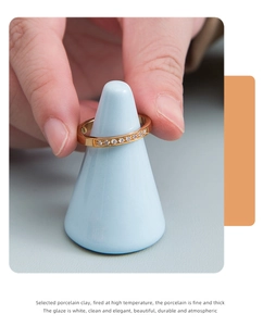 Close-up of eternity gold ring with shimmering round diamonds on a ceramic stand