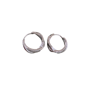 Silver twisted round hoop earrings with zircon stones on a clean white background