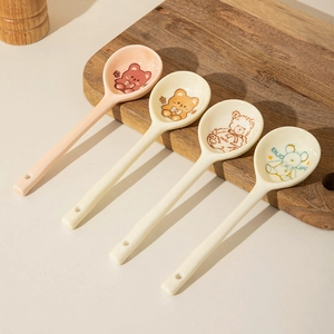 Set of four minimalist ceramic long handle spoons with cute cartoon bear patterns