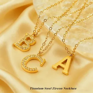 Gold-plated titanium steel alphabet necklaces with zircon pave pendants A, B, and C
