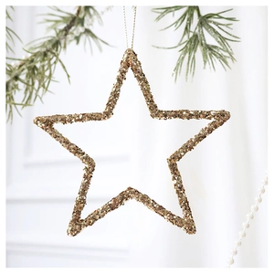 Close-up of champagne gold sequined hollow star ornament hanging on a Christmas tree branch