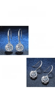 Macro shot of polished S925 silver moissanite earrings with round halo pave setting