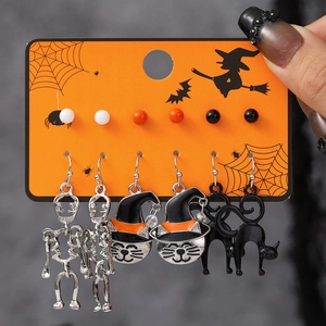 Halloween earring set featuring skeleton and cat charms on an orange display card
