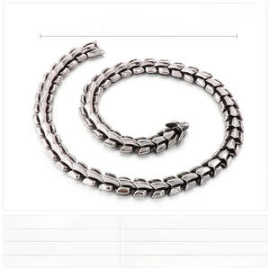 Detail view of heavy punk style stainless steel dragon bone chain necklace for men