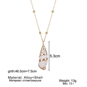 Detail showing dimensions of natural shell pendant with gold plating on white background