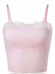 Detail of pink lace trim and thin shoulder straps on a wireless seamless bralette