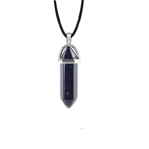 Detail of blue goldstone hexagonal crystal point pendant on black wax cord necklace