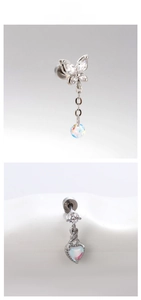 Close-up of butterfly and heart cartilage studs with sparkling zircon stones
