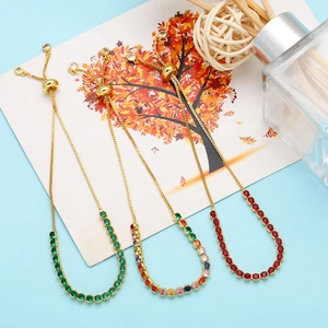 Adjustable gold bracelets with colorful zircons in emerald, rainbow and ruby red
