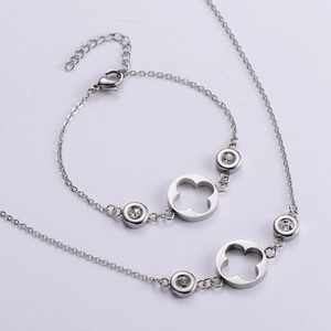 Silver clover jewelry set with zircon necklace and bracelet featuring clover charms