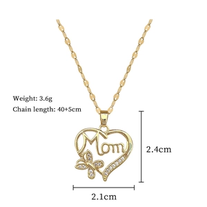 Detailed view of gold Mom heart pendant with butterfly and cubic zirconia stones