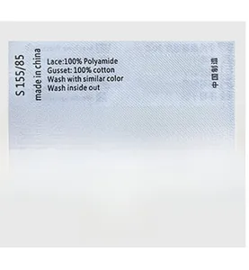 Detail view of lace thong wash care label showing 100% polyamide and cotton materials