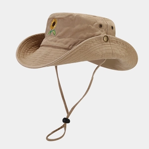 Detailed embroidery of a sunflower on a khaki wide brim cotton sun hat with air vents