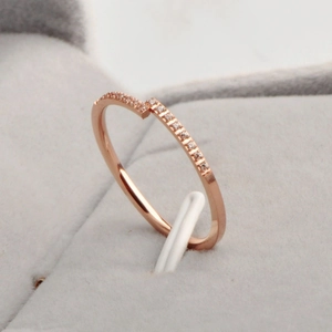Minimalist rose gold open ring with small diamonds in a premium grey velvet jewelry box