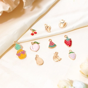 DIY colorful fruit alloy pendants with pineapple, peach, and strawberry designs on silk