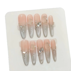 Pink grey gradient cat eye press-on nails with rhinestone chain and pearl accents