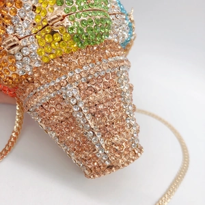 Rainbow crystal bulldog clutch evening bag with champagne diamond studded finish