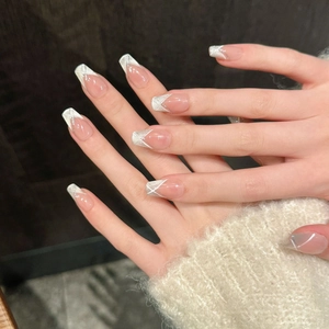 Detail of pink nude coffin press-on nails with silver glitter French tips and white lines