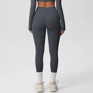 Detail of dark grey high-waisted yoga leggings with push-up seam and breathable fabric